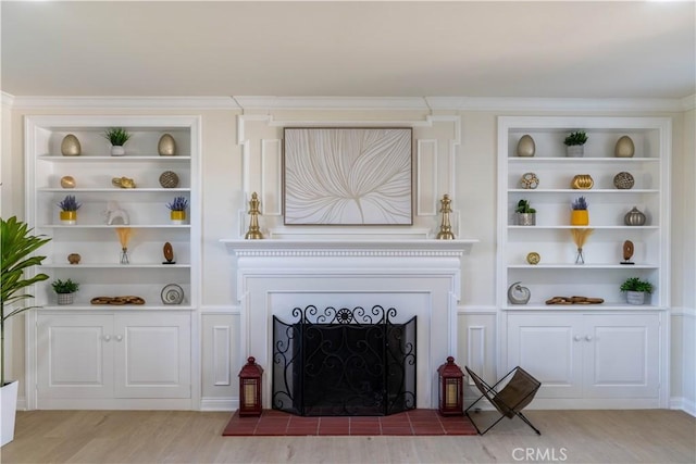 1748 Prince Albert Dr, Riverside, CA 92507 - living room with a fireplace with flush hearth, wood finished floors, and built in shelves