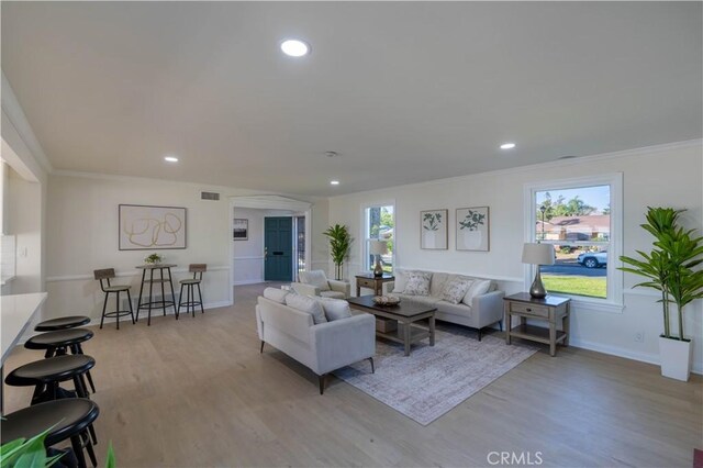 1748 Prince Albert Dr, Riverside, CA 92507 - living room featuring wood finished floors, baseboards, crown molding, and recessed lighting