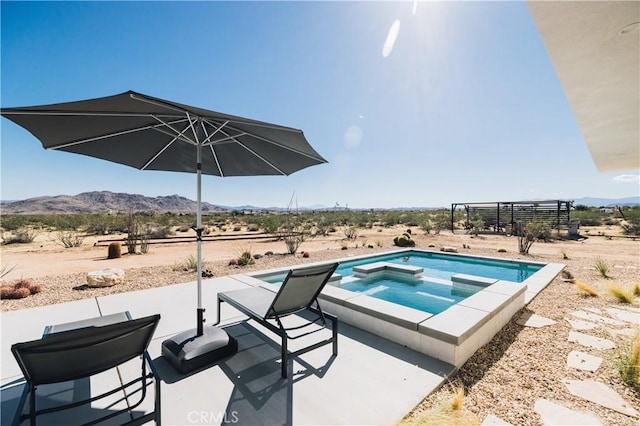 2600 Sunny Vista Rd, Joshua Tree, CA 92252 - view of swimming pool with a mountain view, a patio area, a pool with connected hot tub, and view of desert