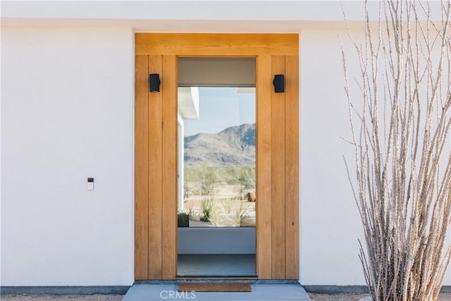 2600 Sunny Vista Rd, Joshua Tree, CA 92252 - entrance to property with stucco siding and a mountain view