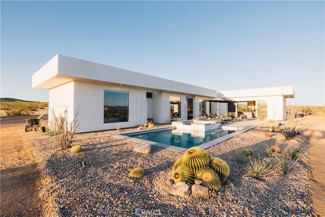 2600 Sunny Vista Rd, Joshua Tree, CA 92252 - back of property featuring stucco siding, a patio area, and an outdoor pool