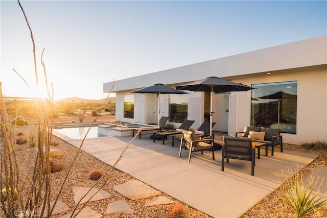 2600 Sunny Vista Rd, Joshua Tree, CA 92252 - rear view of house featuring a patio, an outdoor hangout area, stucco siding, and a pool with connected hot tub
