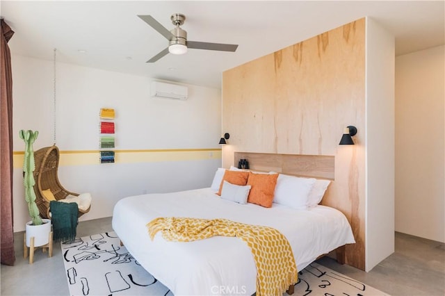 2600 Sunny Vista Rd, Joshua Tree, CA 92252 - bedroom featuring a wall mounted AC, concrete floors, and ceiling fan