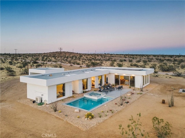 2600 Sunny Vista Rd, Joshua Tree, CA 92252 - back of house with a patio, stucco siding, view of desert landscape, and a pool with connected hot tub
