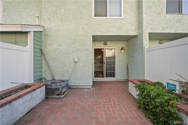 5640 Riverside Dr Unit 119, Chino, CA 91710 - doorway to property featuring stucco siding and a patio area