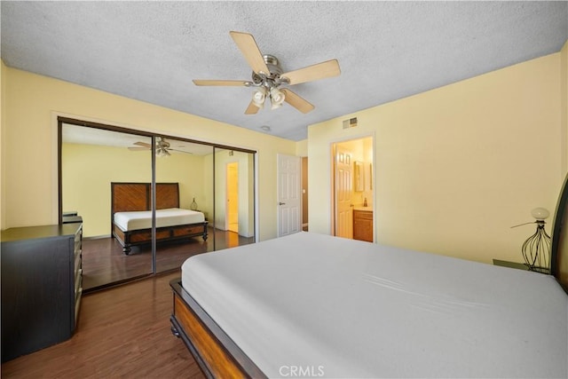 5640 Riverside Dr Unit 119, Chino, CA 91710 - bedroom featuring dark wood-style flooring, a closet, a textured ceiling, and a ceiling fan