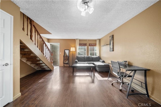 5640 Riverside Dr Unit 119, Chino, CA 91710 - living area with a textured ceiling, baseboards, stairs, dark wood-style flooring, and a textured wall