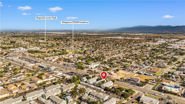 5640 Riverside Dr Unit 119, Chino, CA 91710 - aerial view of property and surrounding area featuring mountains and nearby suburban area