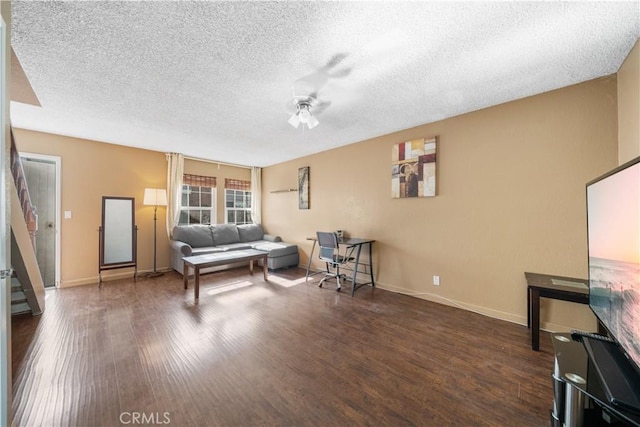 5640 Riverside Dr Unit 119, Chino, CA 91710 - living area with a ceiling fan, dark wood finished floors, a textured ceiling, baseboards, and stairway