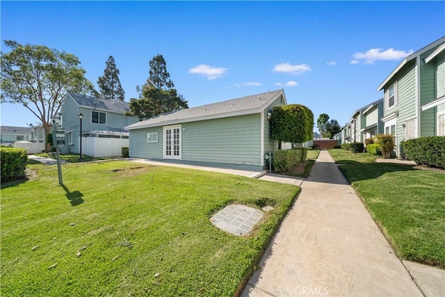5640 Riverside Dr Unit 119, Chino, CA 91710 - back of property featuring a residential view, a yard, and french doors