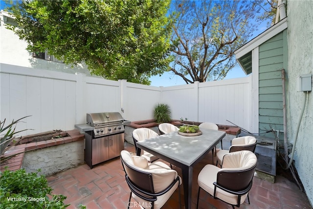 5640 Riverside Dr Unit 119, Chino, CA 91710 - fenced backyard with outdoor dining area, a patio area, and a grill