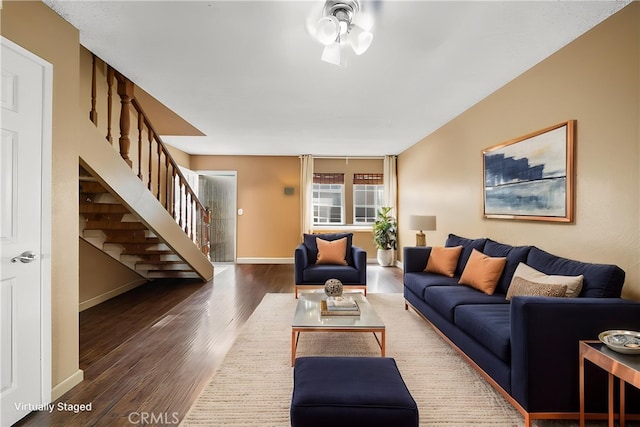 5640 Riverside Dr Unit 119, Chino, CA 91710 - living room with stairs, wood finished floors, baseboards, and ceiling fan