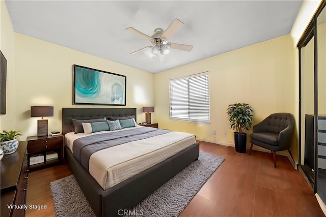 5640 Riverside Dr Unit 119, Chino, CA 91710 - bedroom with wood finished floors, a ceiling fan, and baseboards