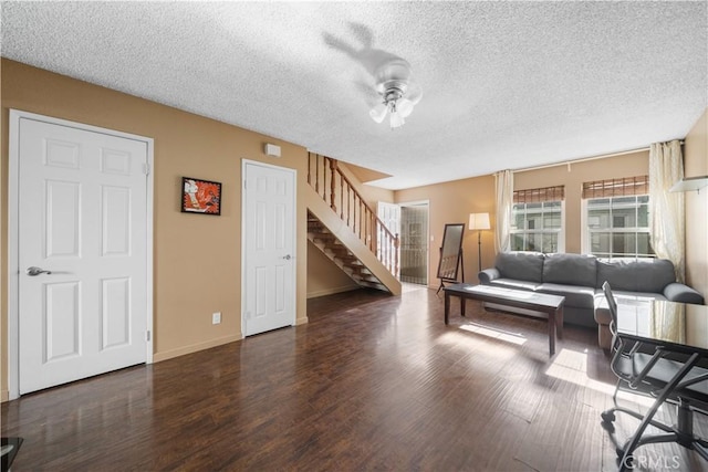 5640 Riverside Dr Unit 119, Chino, CA 91710 - living area featuring stairway, a textured ceiling, wood finished floors, a ceiling fan, and baseboards