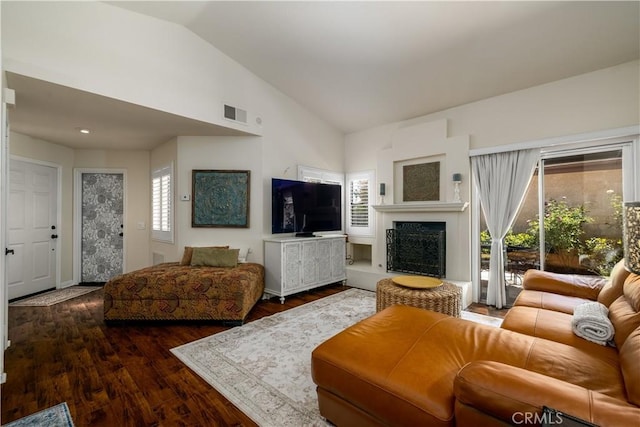 26629 Calle Gregorio, Menifee, CA 92585 - living area with wood finished floors, a fireplace with raised hearth, and high vaulted ceiling