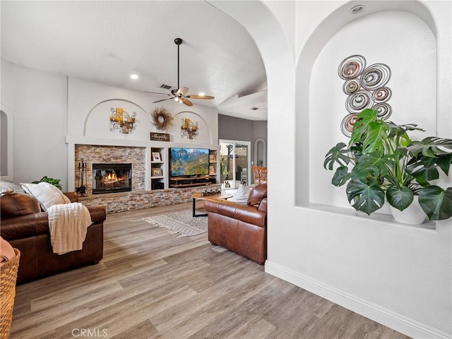 13290DR Country Club Dr, Victorville, CA 92395 - living area with ceiling fan, wood finished floors, arched walkways, recessed lighting, and baseboards