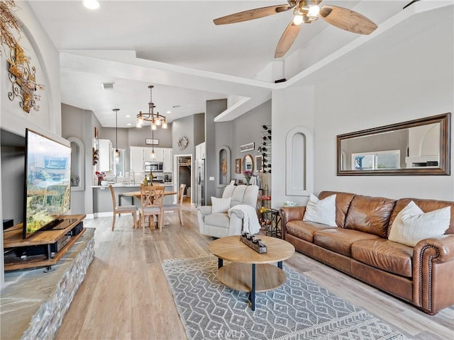 13290DR Country Club Dr, Victorville, CA 92395 - living room with light wood-style floors, a ceiling fan, a chandelier, and recessed lighting