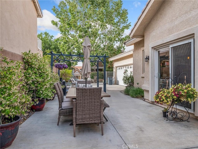 13290DR Country Club Dr, Victorville, CA 92395 - view of patio / terrace featuring an attached garage and outdoor dining space