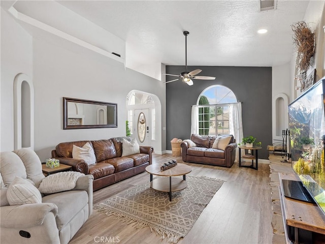 13290DR Country Club Dr, Victorville, CA 92395 - living area featuring arched walkways, ceiling fan, light wood-style flooring, recessed lighting, and baseboards