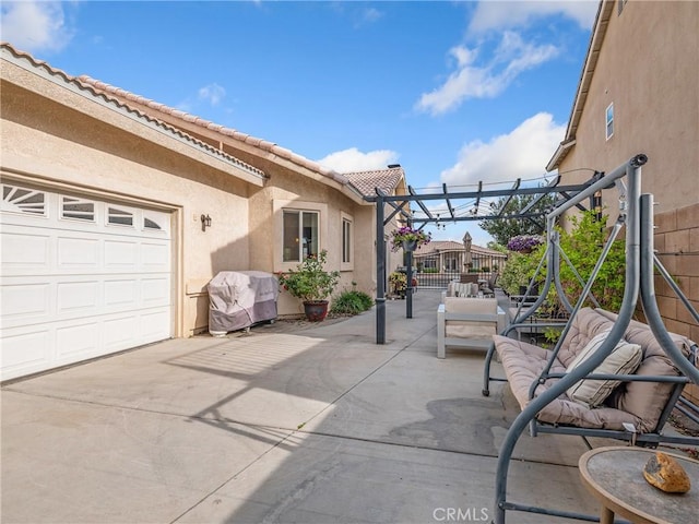 13290DR Country Club Dr, Victorville, CA 92395 - view of patio with an attached garage, driveway, and a pergola