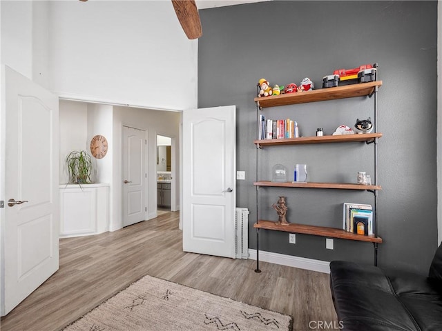 13290DR Country Club Dr, Victorville, CA 92395 - living area with wood finished floors, baseboards, and a towering ceiling
