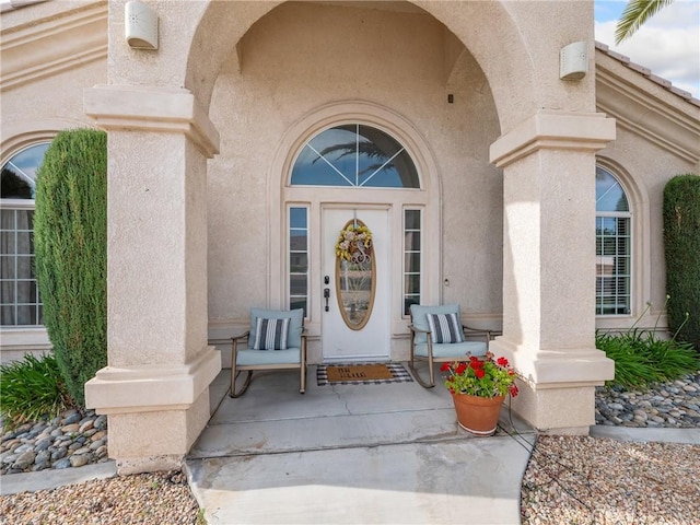 13290DR Country Club Dr, Victorville, CA 92395 - view of exterior entry with stucco siding and covered porch