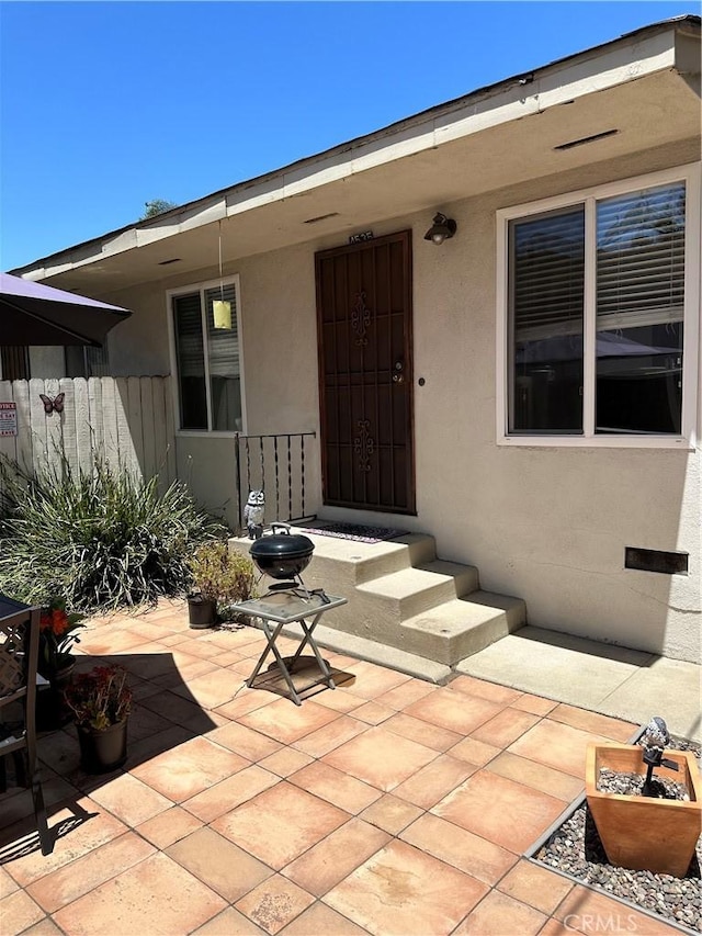 4531 E 10th St, Long Beach, CA 90804 - doorway to property featuring a patio area and stucco siding