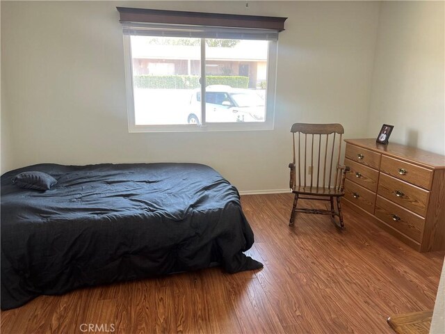 615 S Palm Ave Unit D, Hemet, CA 92543 - bedroom featuring wood finished floors and baseboards