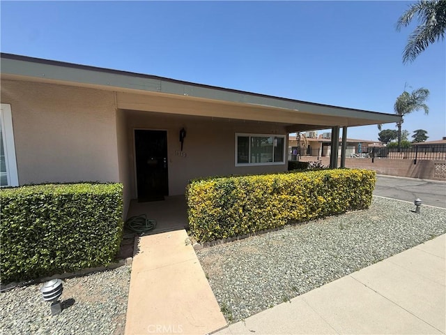 615 S Palm Ave Unit D, Hemet, CA 92543 - doorway to property featuring stucco siding