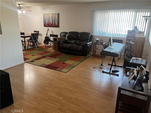 615 S Palm Ave Unit D, Hemet, CA 92543 - living room featuring plenty of natural light, wood finished floors, and ceiling fan