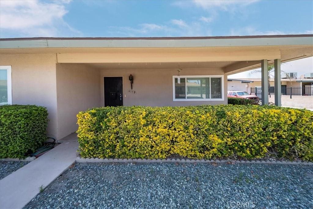 615 S Palm Ave Unit D, Hemet, CA 92543 - doorway to property featuring stucco siding