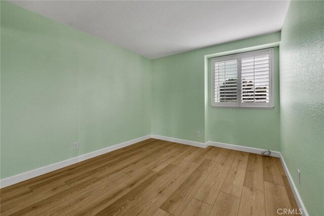 21020 Bryan Cir, Walnut, CA 91789 - empty room featuring light wood-style floors and baseboards