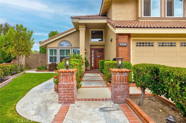 21020 Bryan Cir, Walnut, CA 91789 - property entrance featuring stucco siding, an attached garage, and a tile roof