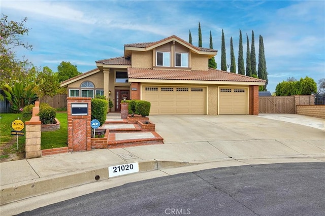 21020 Bryan Cir, Walnut, CA 91789 - view of front of property featuring stucco siding, a tiled roof, concrete driveway, and a garage