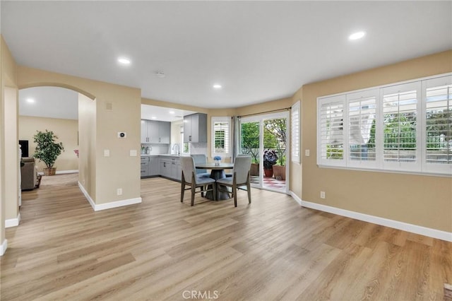 21020 Bryan Cir, Walnut, CA 91789 - dining area with arched walkways, light wood-type flooring, baseboards, and recessed lighting