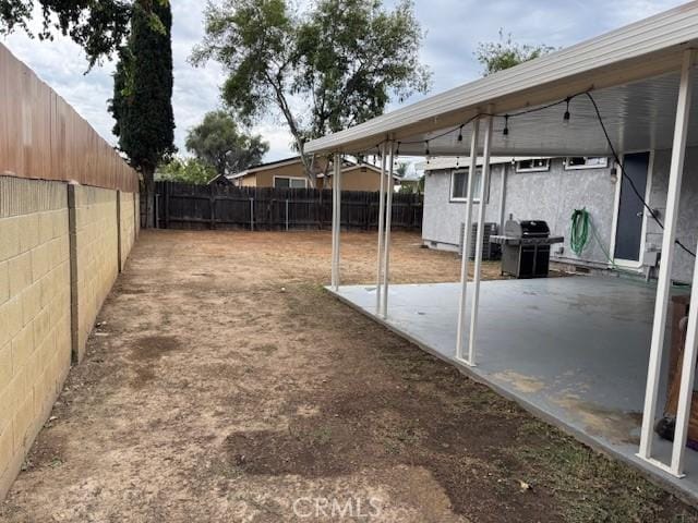 3400 Glasgow Cir, Riverside, CA 92503 - fenced backyard with a patio area