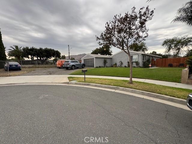 3400 Glasgow Cir, Riverside, CA 92503 - view of front of house with asphalt driveway and an attached garage