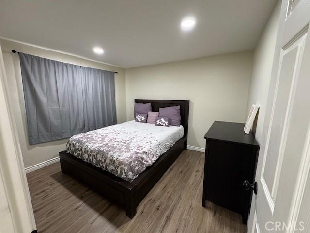 3400 Glasgow Cir, Riverside, CA 92503 - bedroom with wood finished floors, recessed lighting, and baseboards