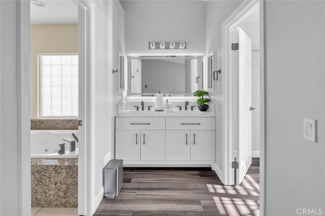 31780 Sierra Del Sol, Thousand Palms, CA 92276 - full bathroom featuring vanity, a garden tub, and wood finished floors