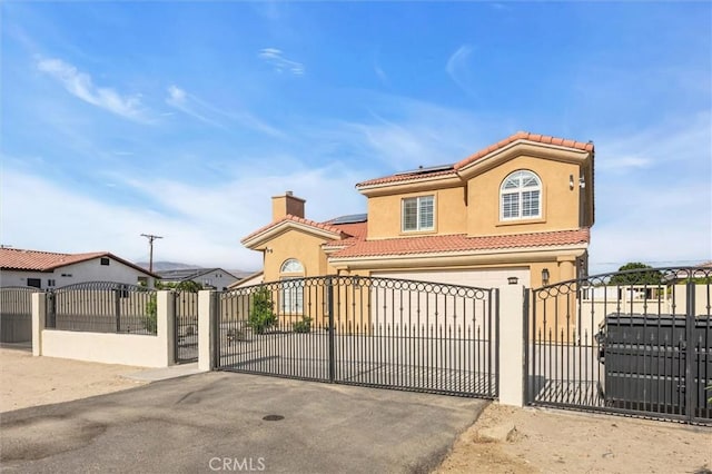 31780 Sierra Del Sol, Thousand Palms, CA 92276 - gate featuring a fenced front yard and roof mounted solar panels