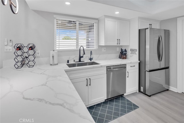 31780 Sierra Del Sol, Thousand Palms, CA 92276 - kitchen featuring appliances with stainless steel finishes, a sink, recessed lighting, white cabinets, and light stone counters