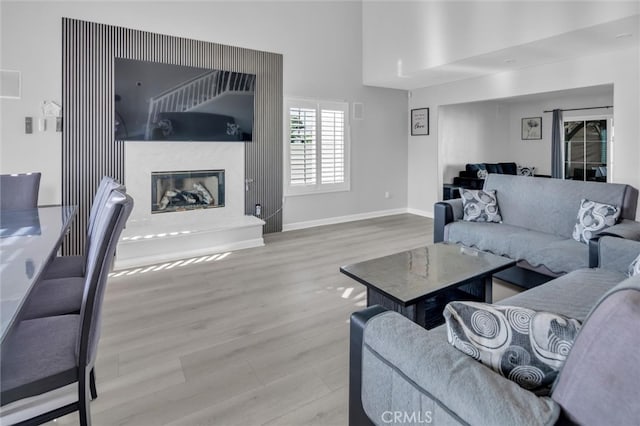 31780 Sierra Del Sol, Thousand Palms, CA 92276 - living area with wood finished floors, a fireplace, and baseboards