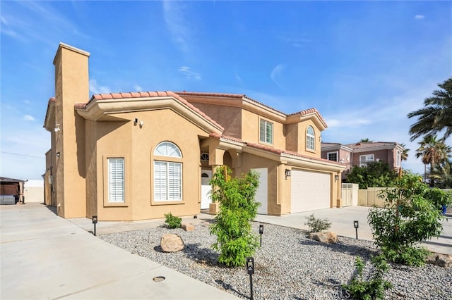 31780 Sierra Del Sol, Thousand Palms, CA 92276 - mediterranean / spanish-style home featuring a tile roof, concrete driveway, stucco siding, a garage, and a chimney
