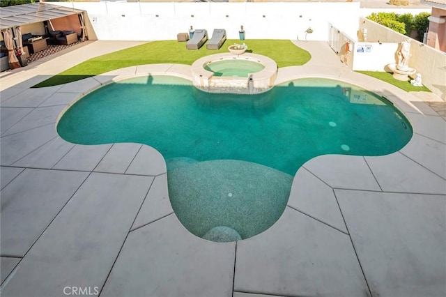 31780 Sierra Del Sol, Thousand Palms, CA 92276 - view of swimming pool featuring a fenced backyard, a patio area, a pool with connected hot tub, and an outdoor living space