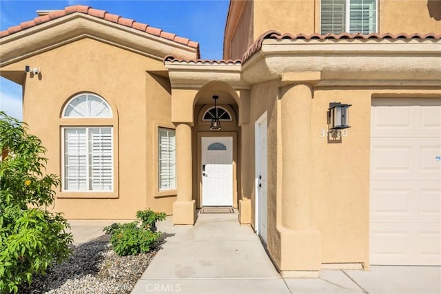 31780 Sierra Del Sol, Thousand Palms, CA 92276 - doorway to property with stucco siding and a tiled roof