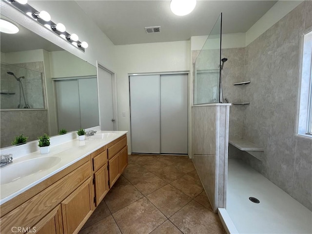 24967 Volga St, Hemet, CA 92544 - bathroom with a walk in shower, double vanity, and tile patterned floors