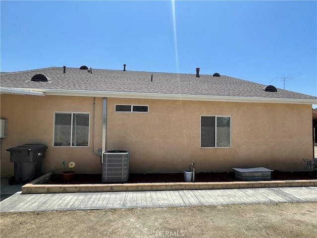 24967 Volga St, Hemet, CA 92544 - back of property with central air condition unit, stucco siding, and a shingled roof