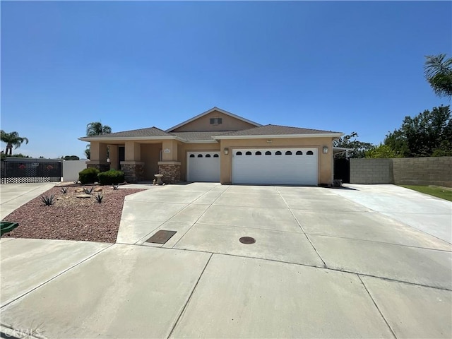 24967 Volga St, Hemet, CA 92544 - view of front facade featuring a garage, concrete driveway, and stucco siding