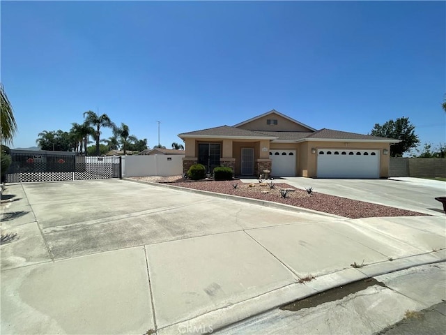 24967 Volga St, Hemet, CA 92544 - view of front of home featuring driveway, a garage, and stucco siding