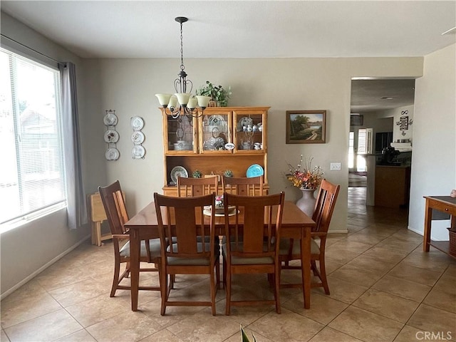 24967 Volga St, Hemet, CA 92544 - dining area with a chandelier, plenty of natural light, and light tile patterned floors